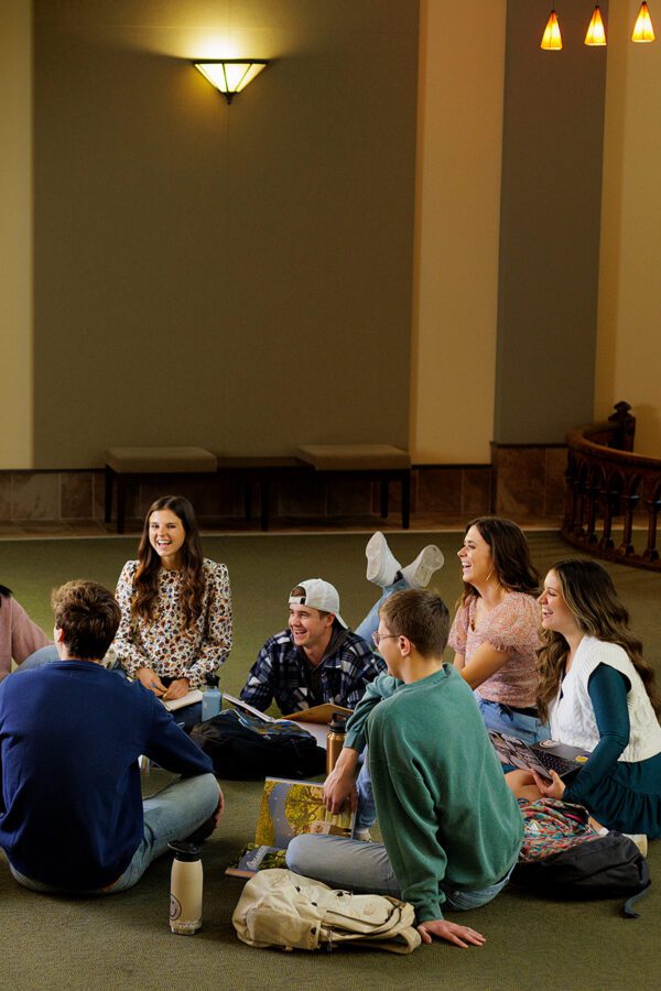 Students gather around in Centennial Chapel