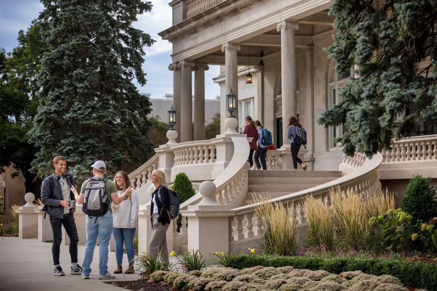 Group of friends having a conversation in front of Burke