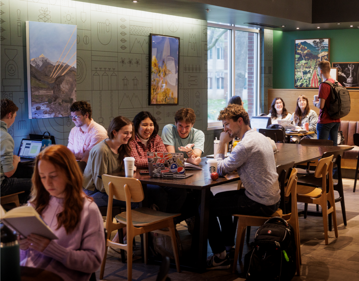 Group of friends chatting over coffee in Starbucks