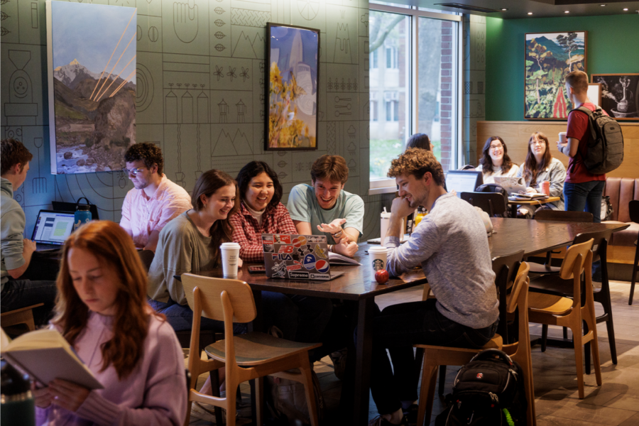 Group of friends chatting over coffee in Starbucks