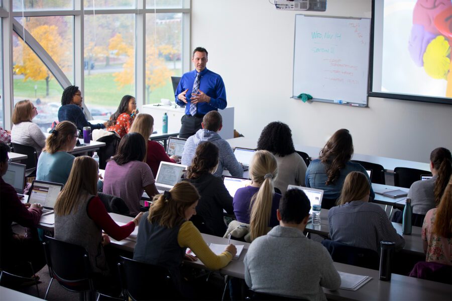 Psychology professor teaching to a group of students