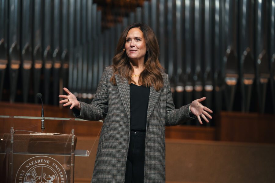 Photo of Alumna Tara Beth Leach speaking in Chapel at Olivet nazarene University