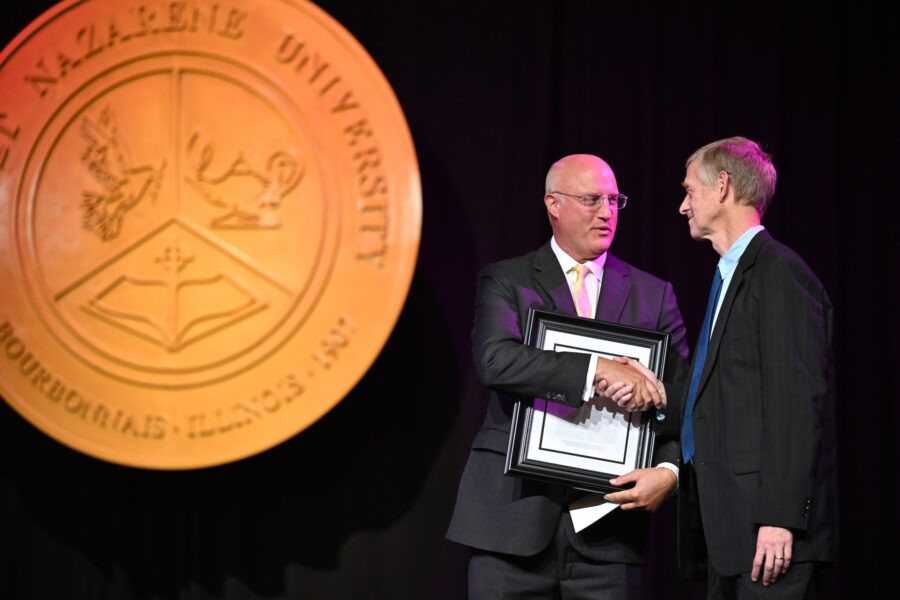 Dale Hathaway receiving award from Gregg Chenoweth