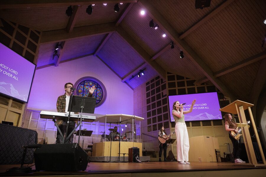 students singing on stage at College Church