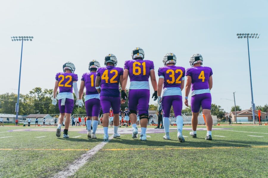 Football players walking on the field